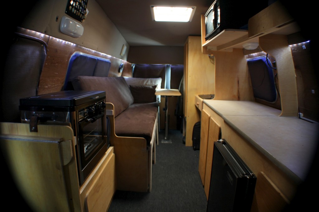The interior of the van, from the passenger seat looking back